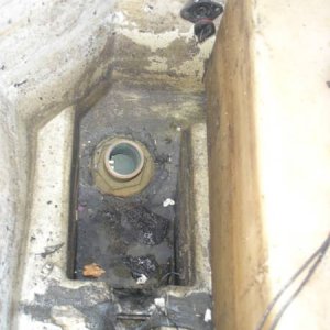Black_plastic_Hull_drain_in_bilge.jpg