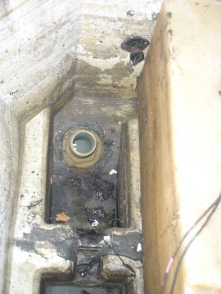 Black_plastic_Hull_drain_in_bilge.jpg